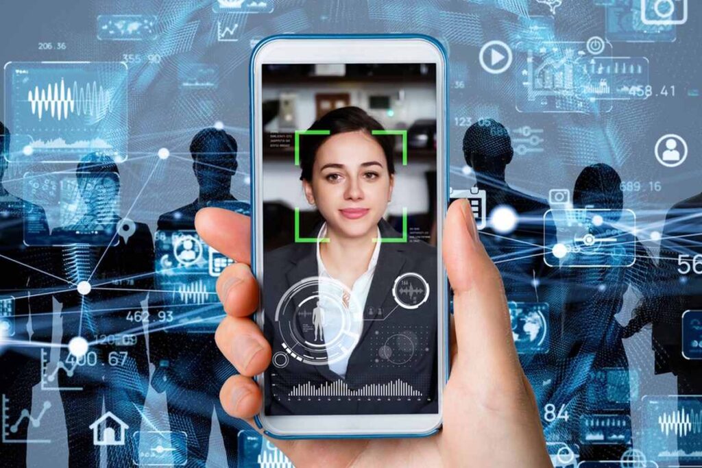 Hand holding smartphone displaying a woman's face