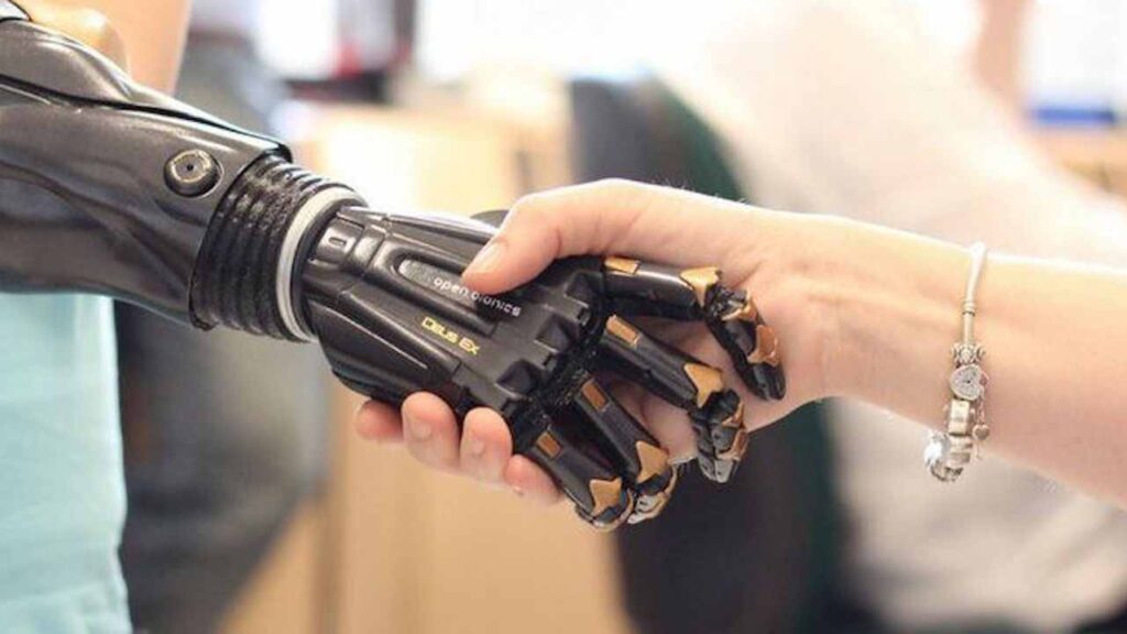 A human hand and a robotic hand touching