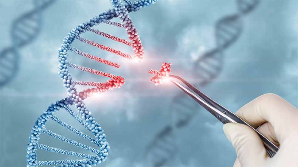 A hand holding tweezers that manipulate glowing red DNA
