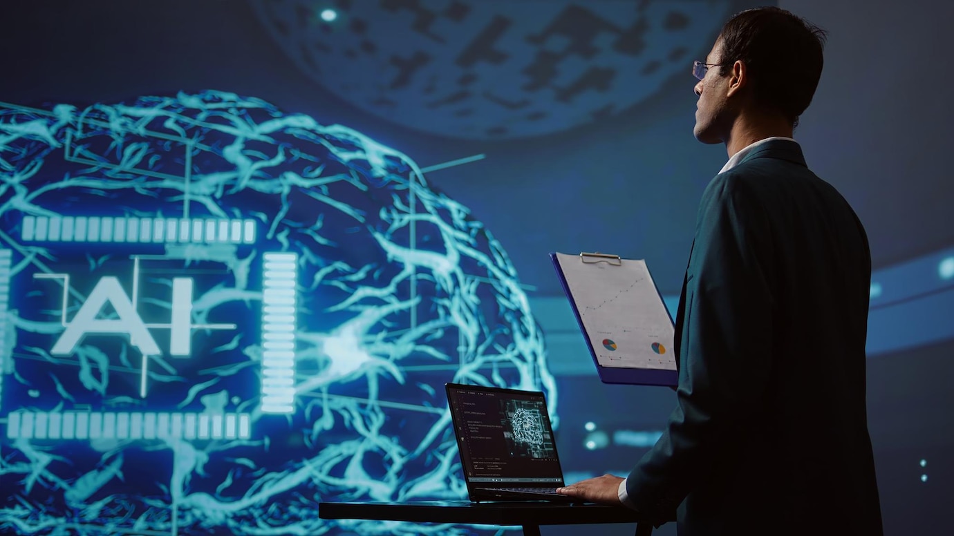 A professional stands before a large digital display featuring an illuminated AI