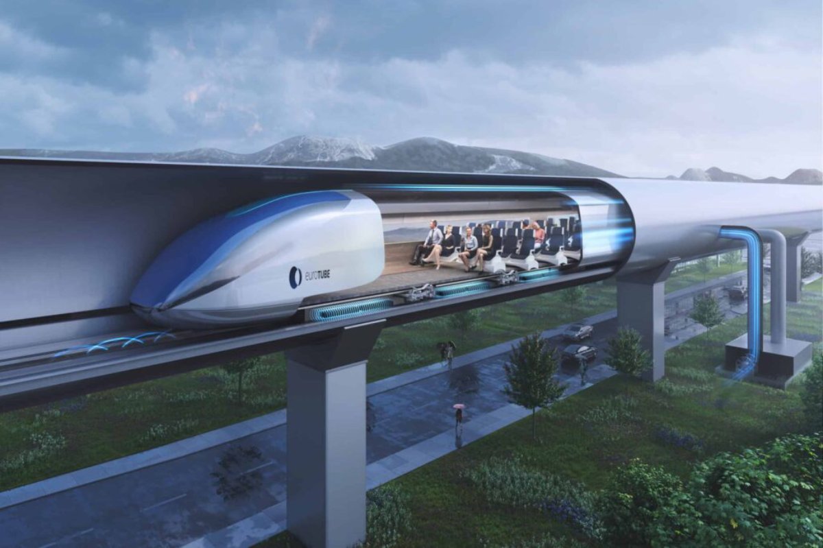 Futuristic elevated train carrying passengers through a lush landscape under a cloudy sky.