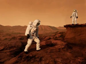 Two astronauts exploring a rocky, Mars-like terrain under an orange sky.